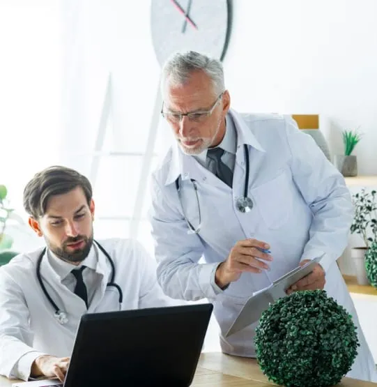 Two medical professionals discussing medical cannabis guidance